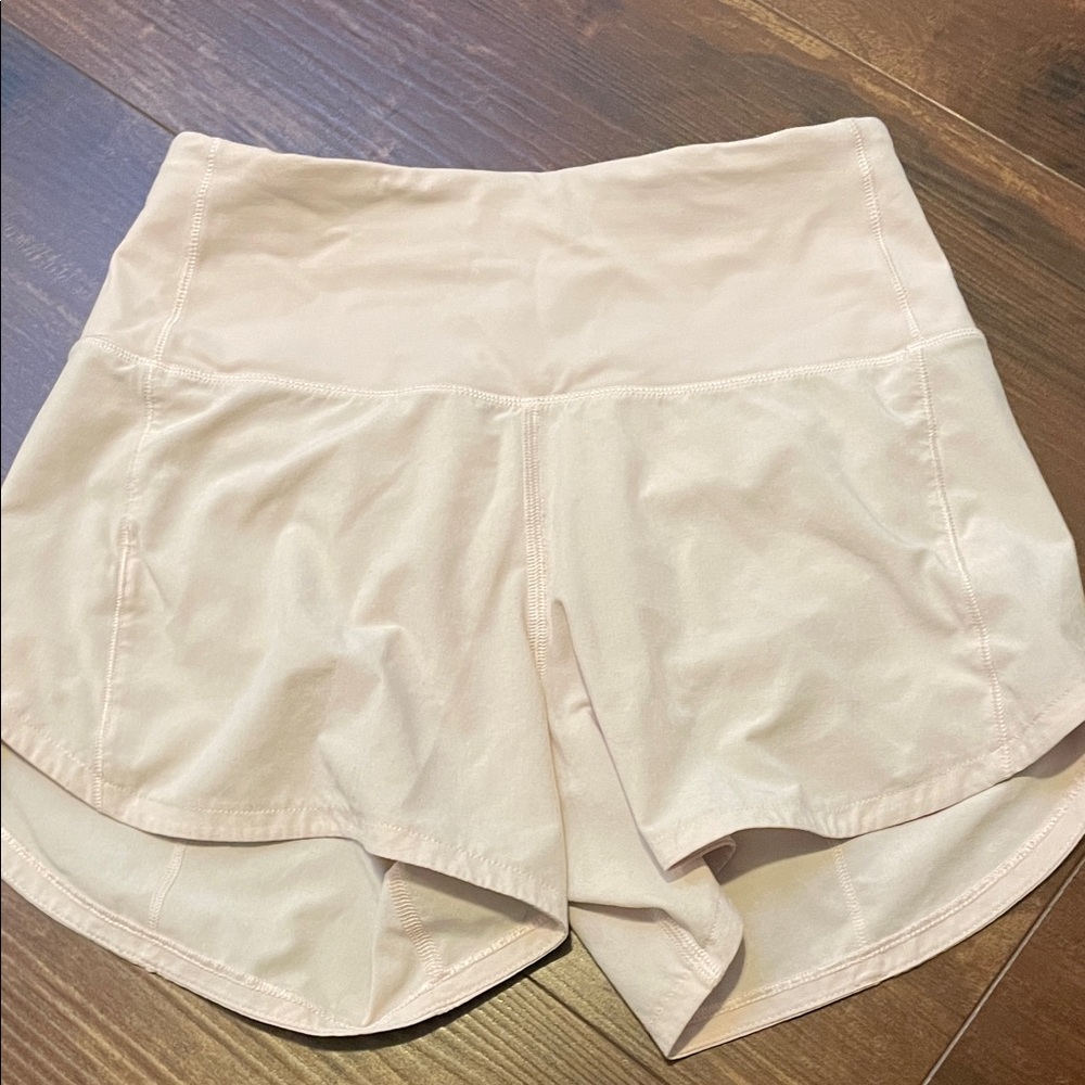 lululemon speed up 4” light pink shorts